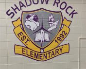 shadow rock logo on wall