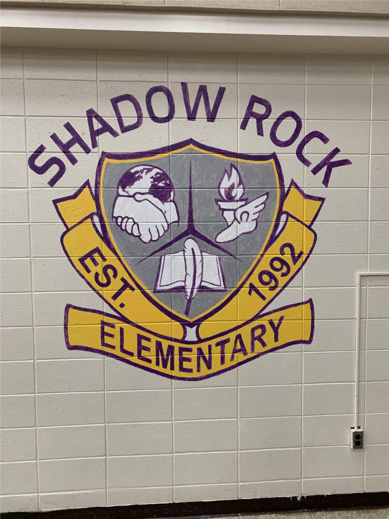 shadow rock logo on wall