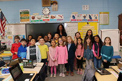 Ms. Veena Black With classroom